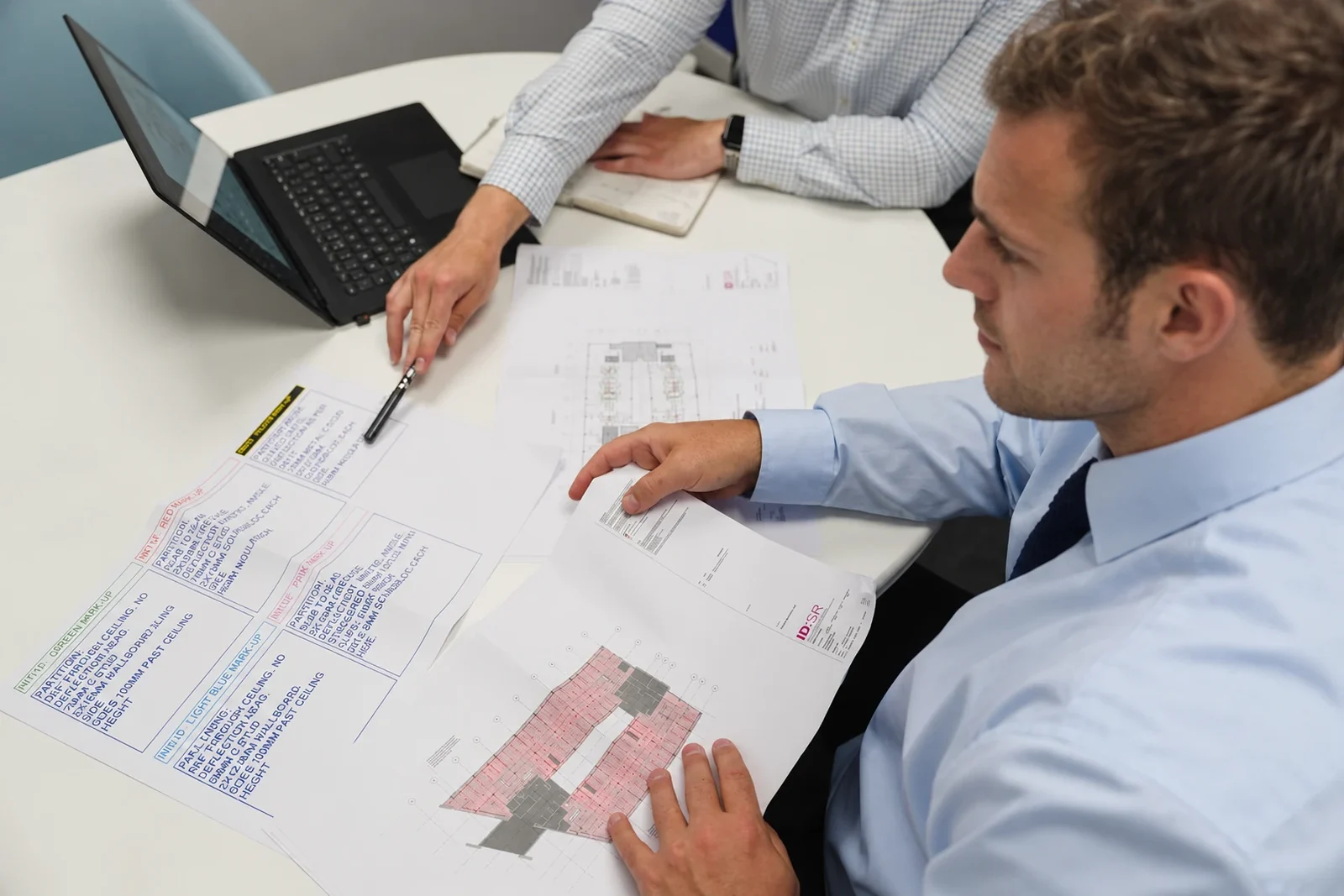 CIG colleagues working through project drawings